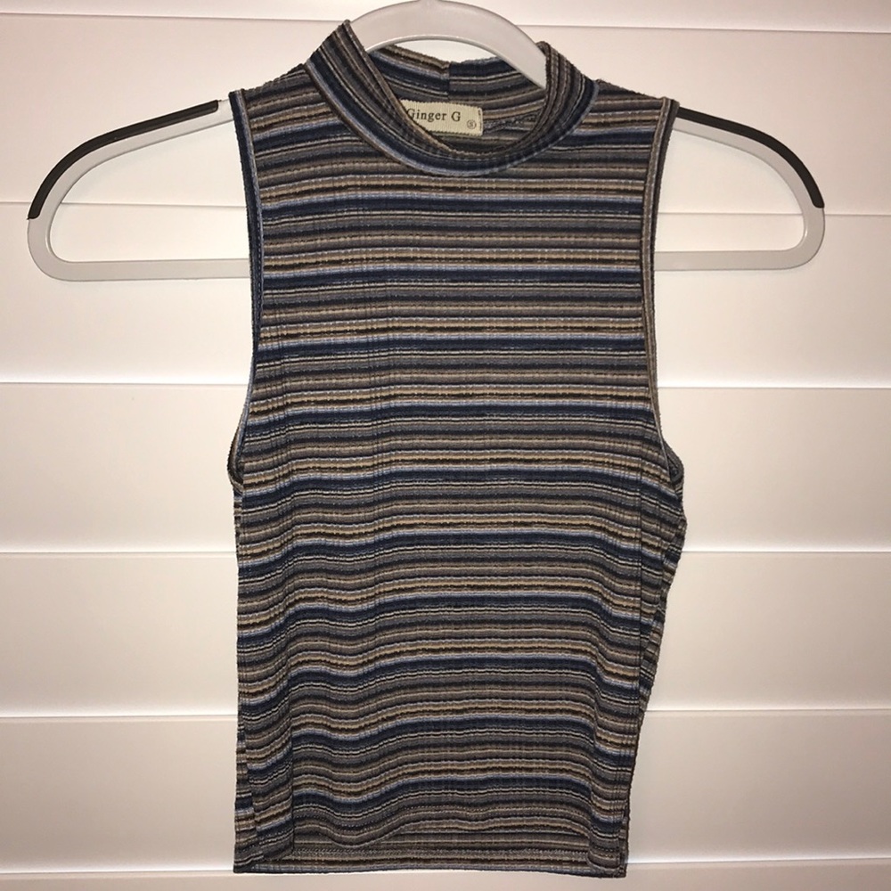 A multi colored turtle neck tank top